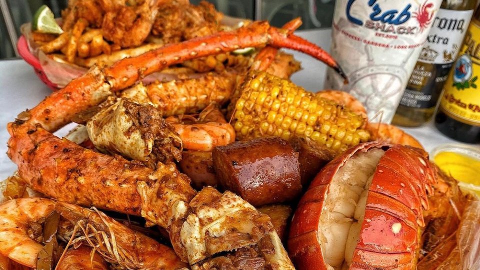 Sports bar seating beside Cajun dishes.